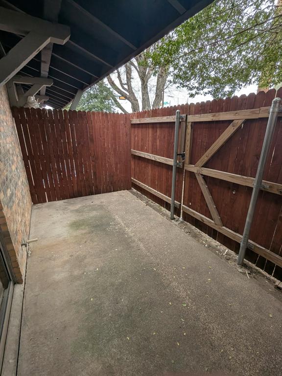 514 East Belt Line Road, Unit B13 DeSoto, TX 75115 - Photo 25 of 28 a view of backyard with wooden fence and large trees