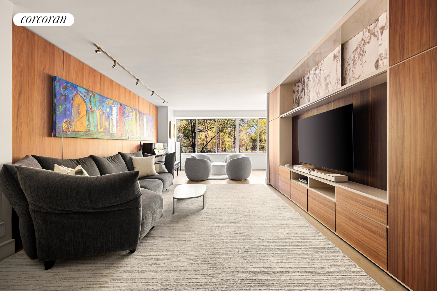 a living room with furniture and a flat screen tv