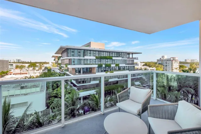 a view of roof deck with seating space and plants