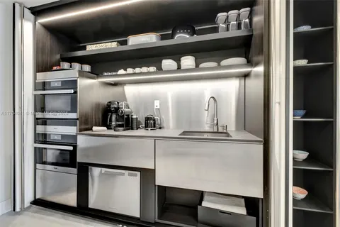 a kitchen with a refrigerator and cabinets