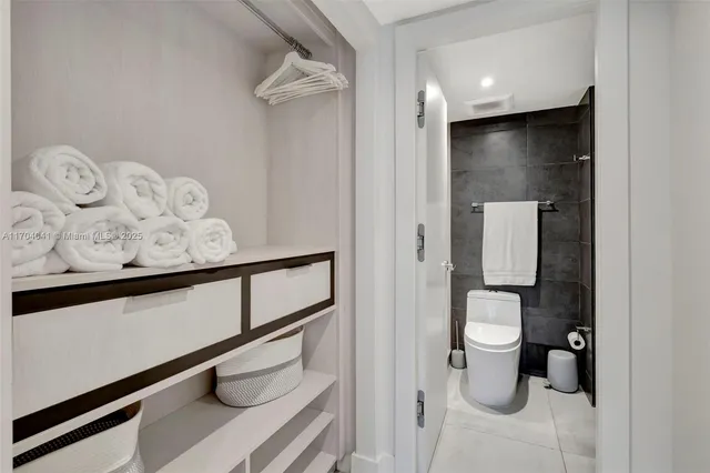 a view of a hallway with bathroom