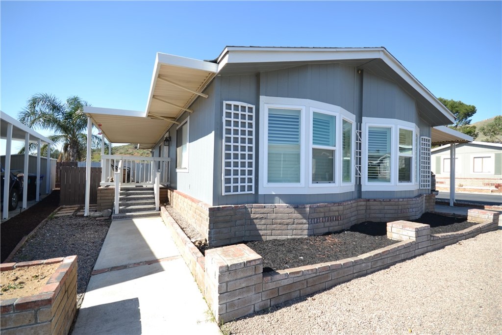 4080 Pedley Road, Unit 210 Jurupa Valley, CA 92509 - Photo 1 of 1 a front view of a house with a yard