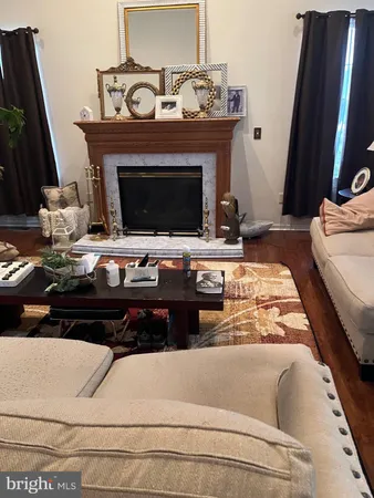 a room with furniture and wooden floor