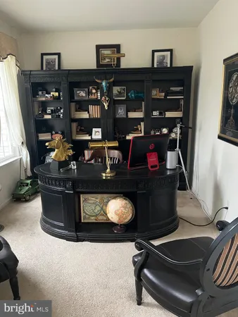 a living room with couches and a table with wooden floor