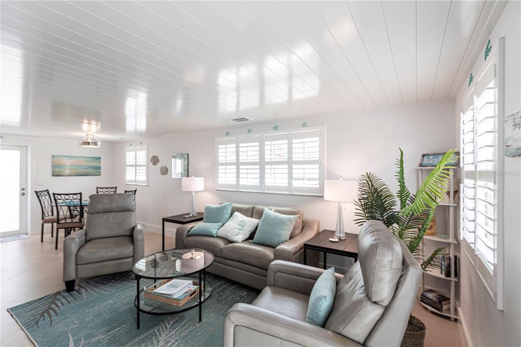 6154 Midnight Pass Road, Unit A1 Sarasota, FL 34242 - Photo 2 of 19 a living room with furniture and a large window