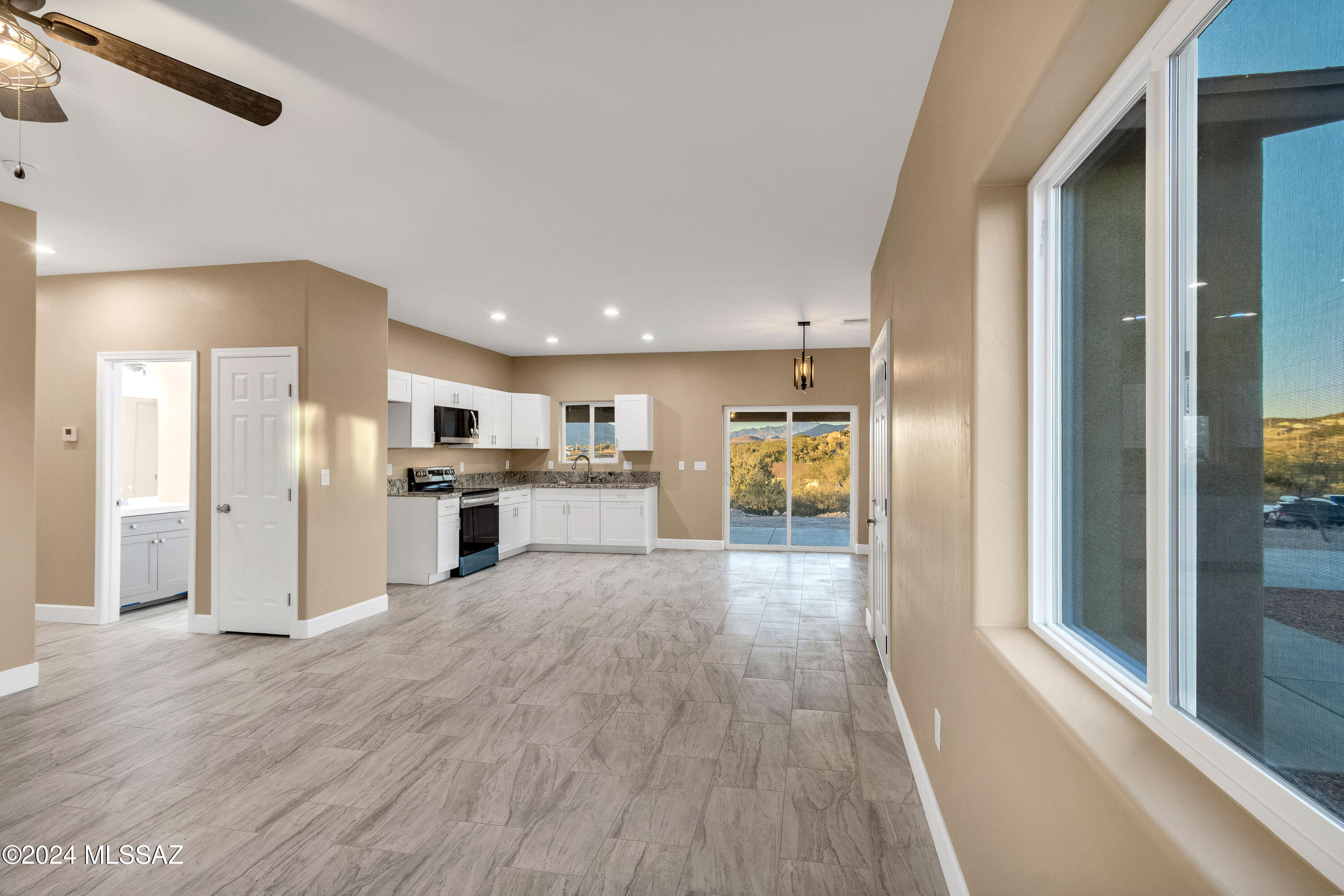 221 Paseo Mascota Rio Rico, AZ 85648 - Photo 7 of 45 a view of a kitchen with a sink and refrigerator