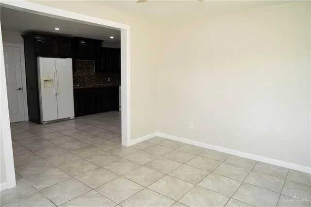 an empty room with wooden floor