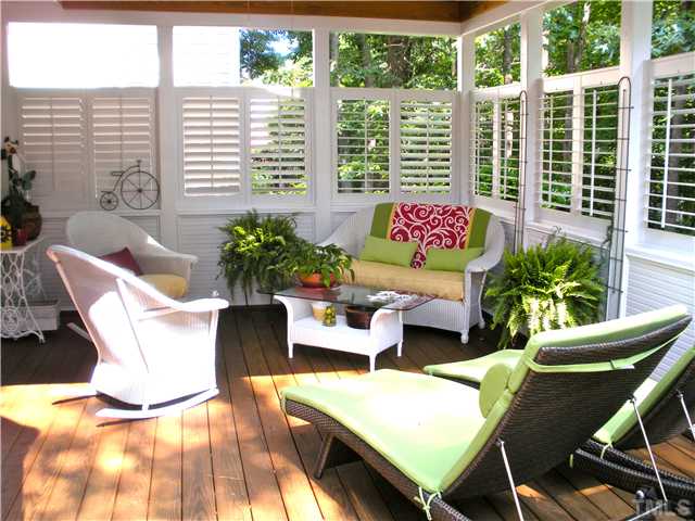 1921 Torrington Street Raleigh, NC 27615 - Photo 12 of 25 Plantation shutters (made for outdoors) add privacy and a nice architectural element.