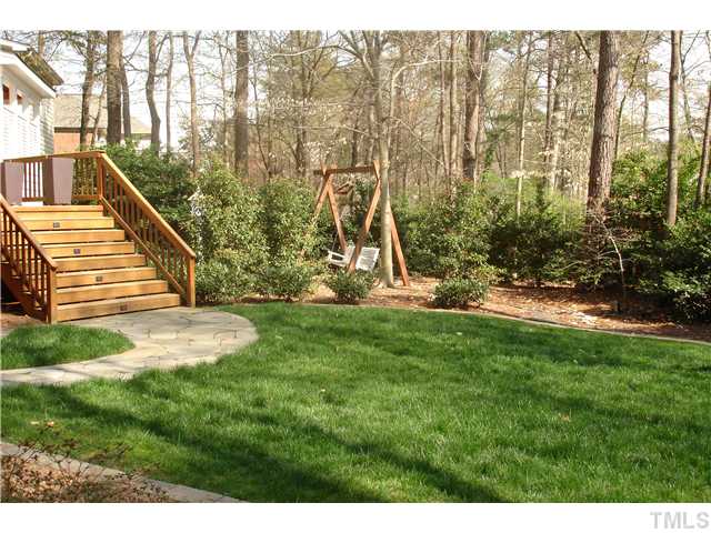 1921 Torrington Street Raleigh, NC 27615 - Photo 13 of 25 Professionally landscaped yard with a sprinkler system, flagstone walkways and borders.