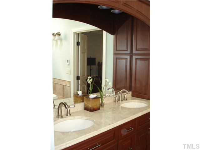 1921 Torrington Street Raleigh, NC 27615 - Photo 16 of 25 Elegant cabinets surround the raised sinks with granite tops.