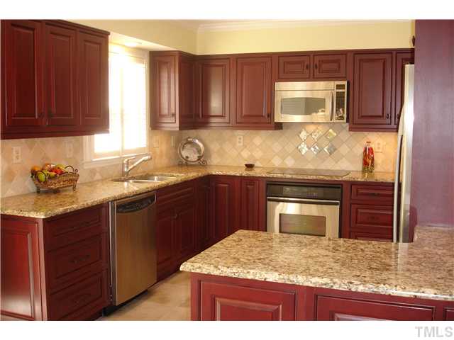 1921 Torrington Street Raleigh, NC 27615 - Photo 5 of 25 Unbelievable! Owners have replaced the kitchen cabinets, granite tops, stainless steel appliances and added the tile floor.