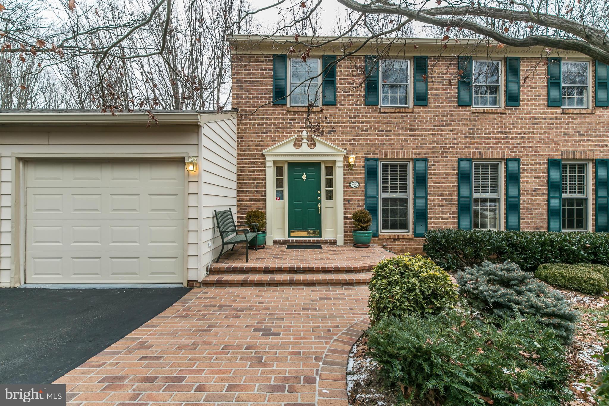 10710 Cross School Road Reston, VA 20191 - Photo 2 of 7 a front view of a house with a garden