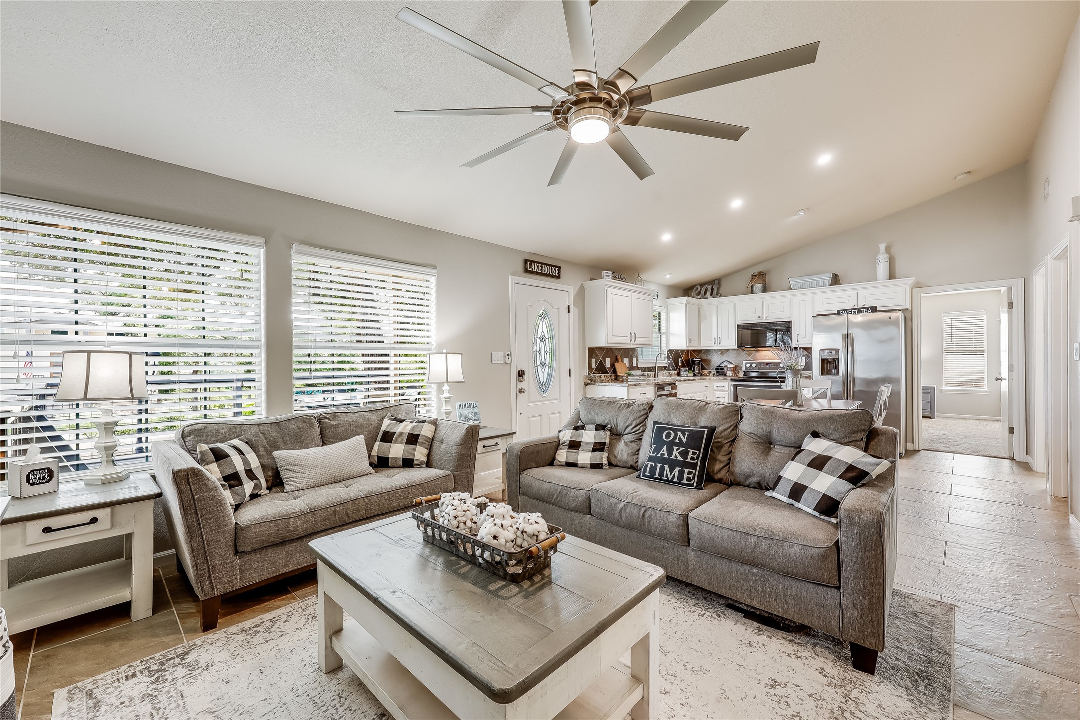 426 Summit Ridge Drive North Point Venture, TX 78645 - Photo 6 of 28 Living room featuring vaulted ceiling and ceiling fan