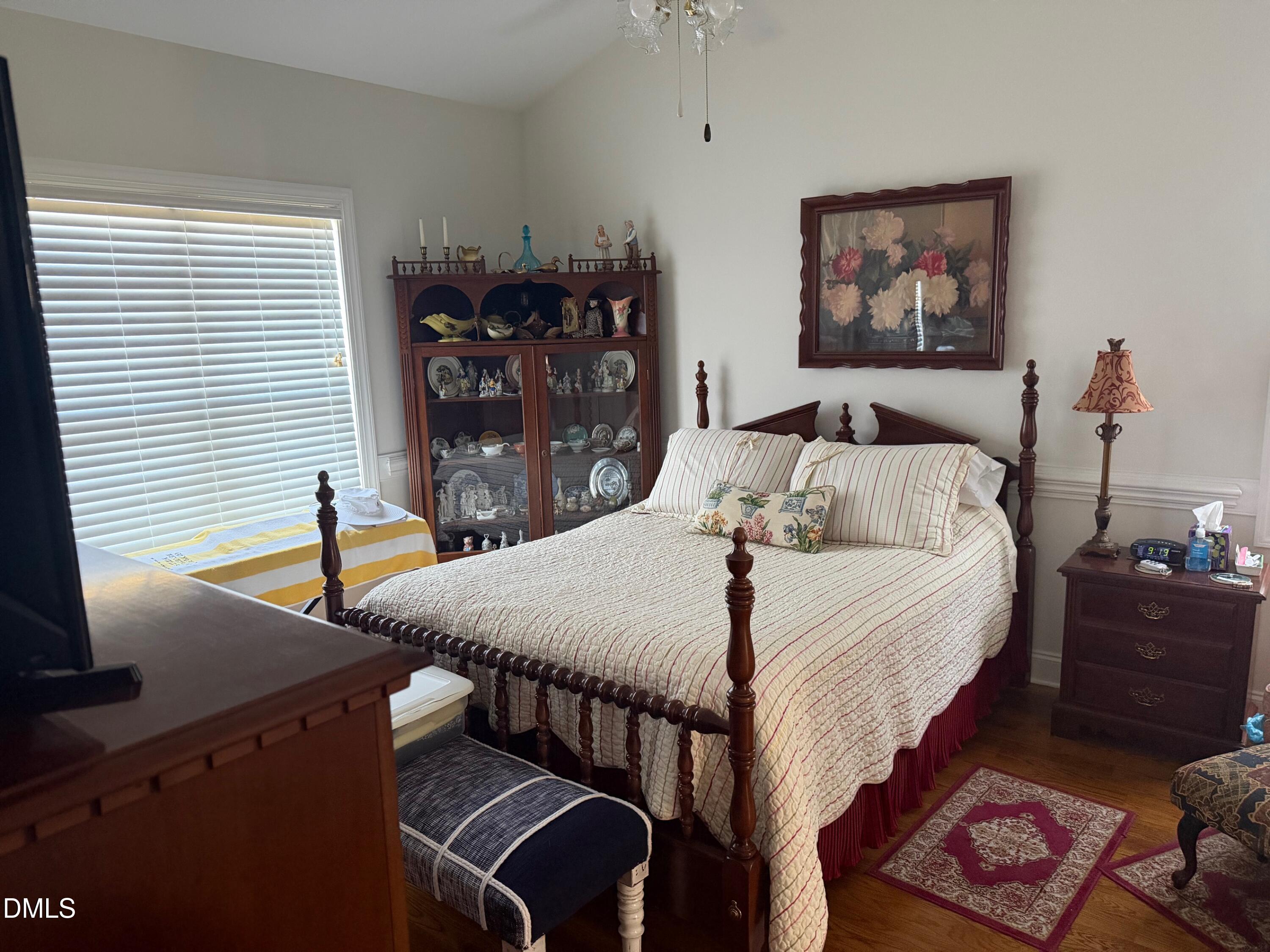 6949 Rock Ridge Sims Road Sims, NC 27880 - Photo 16 of 24 a bedroom with bed and a night stand