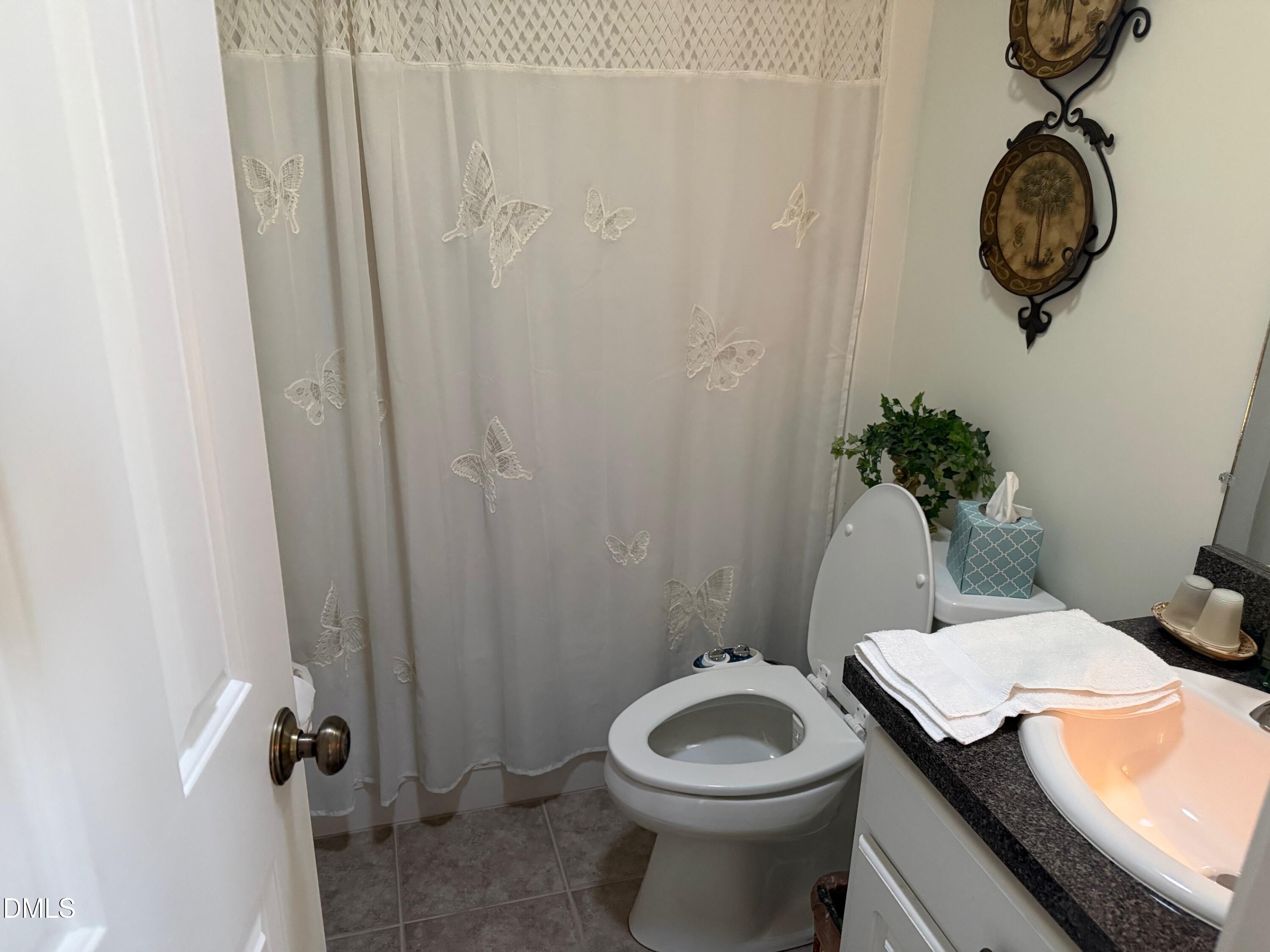 6949 Rock Ridge Sims Road Sims, NC 27880 - Photo 18 of 24 a bathroom with a granite countertop sink toilet and shower
