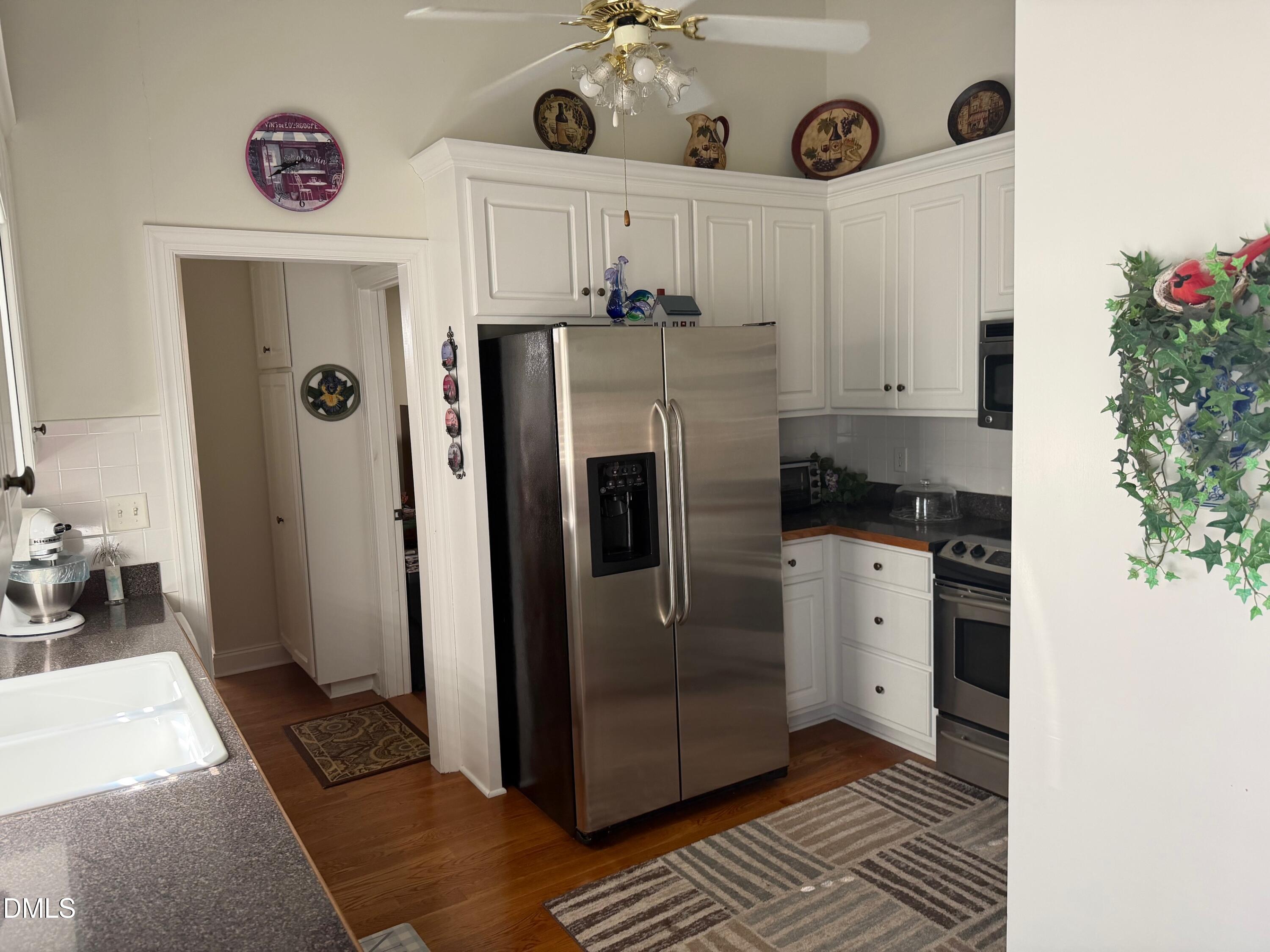 6949 Rock Ridge Sims Road Sims, NC 27880 - Photo 21 of 24 a kitchen with stainless steel appliances granite countertop a refrigerator and a stove