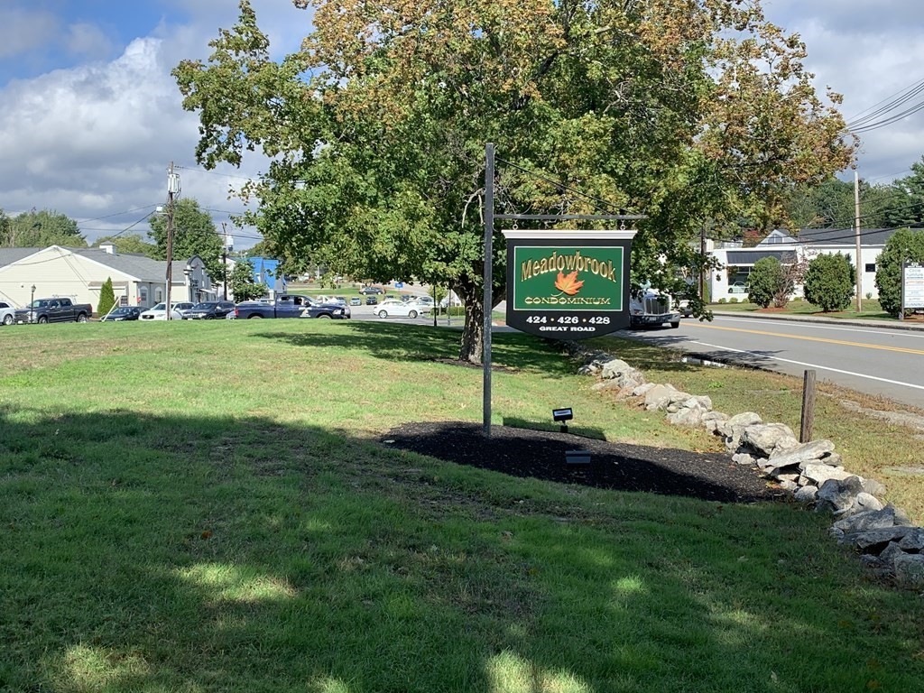424 Great Road, Unit 2 Acton, MA 01720 - Photo 1 of 13 a view of a house with a big yard
