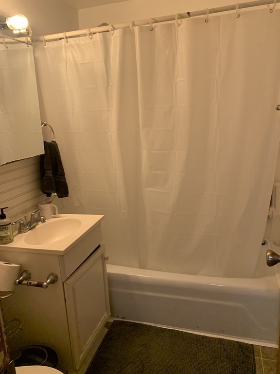 424 Great Road, Unit 2 Acton, MA 01720 - Photo 6 of 13 a bathroom with a sink and a mirror