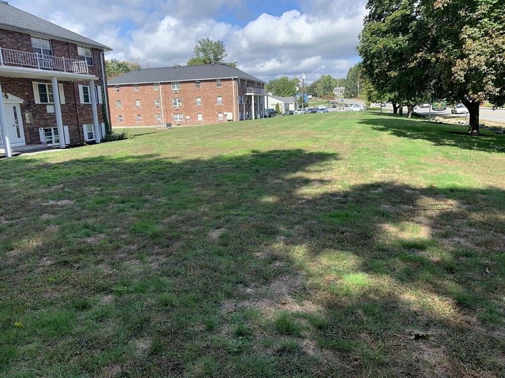 424 Great Road, Unit 2 Acton, MA 01720 - Photo 8 of 13 a view of a big yard with large trees