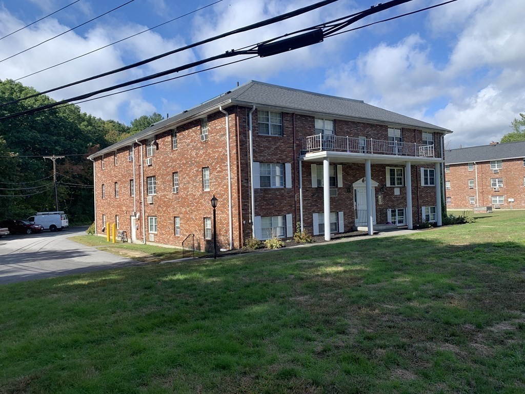 424 Great Road, Unit 2 Acton, MA 01720 - Photo 9 of 13 a view of a house with backyard and porch