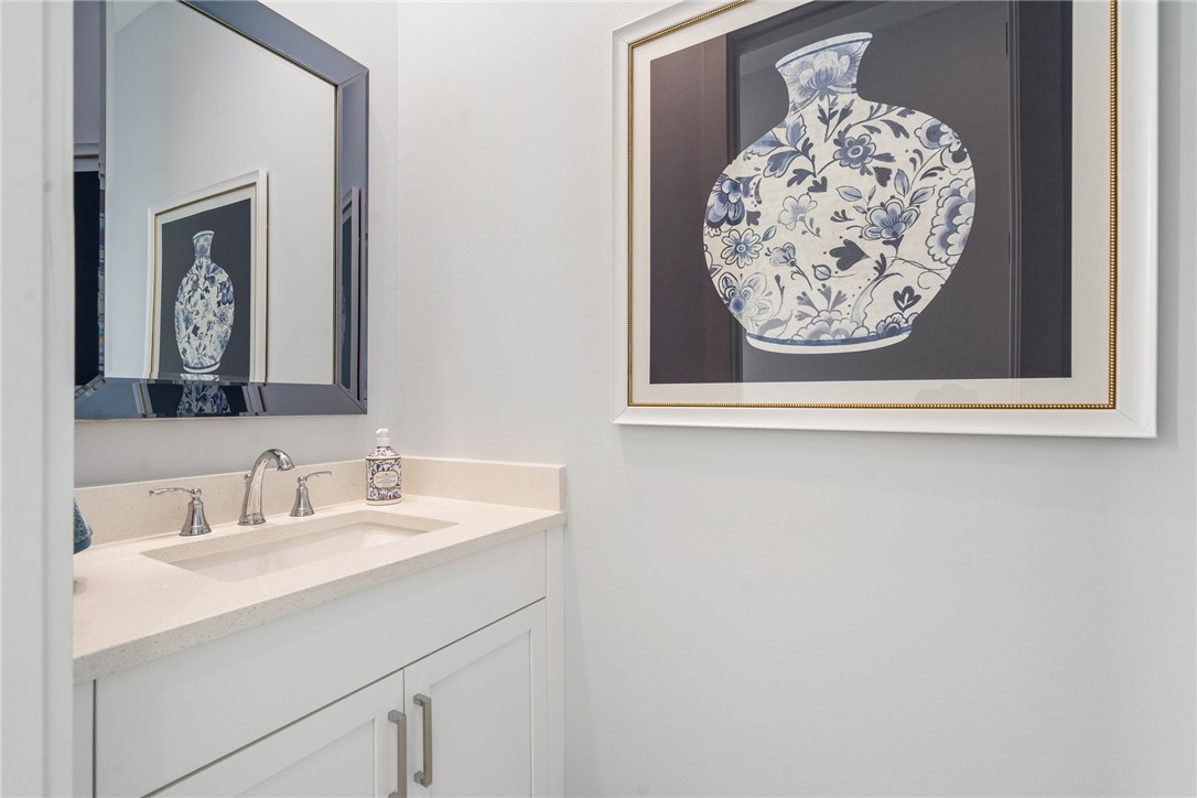 2159 Falls Manor Vero Beach, FL 32967 - Photo 26 of 36 a bathroom with a sink and a mirror