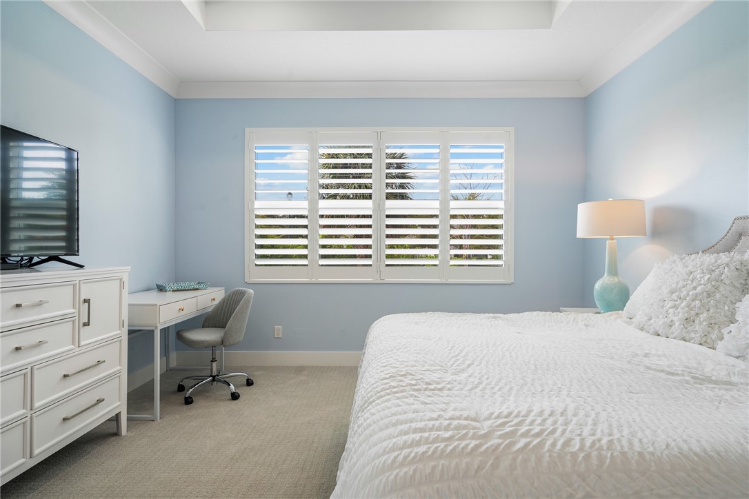 2159 Falls Manor Vero Beach, FL 32967 - Photo 28 of 36 a bedroom with a bed and a window