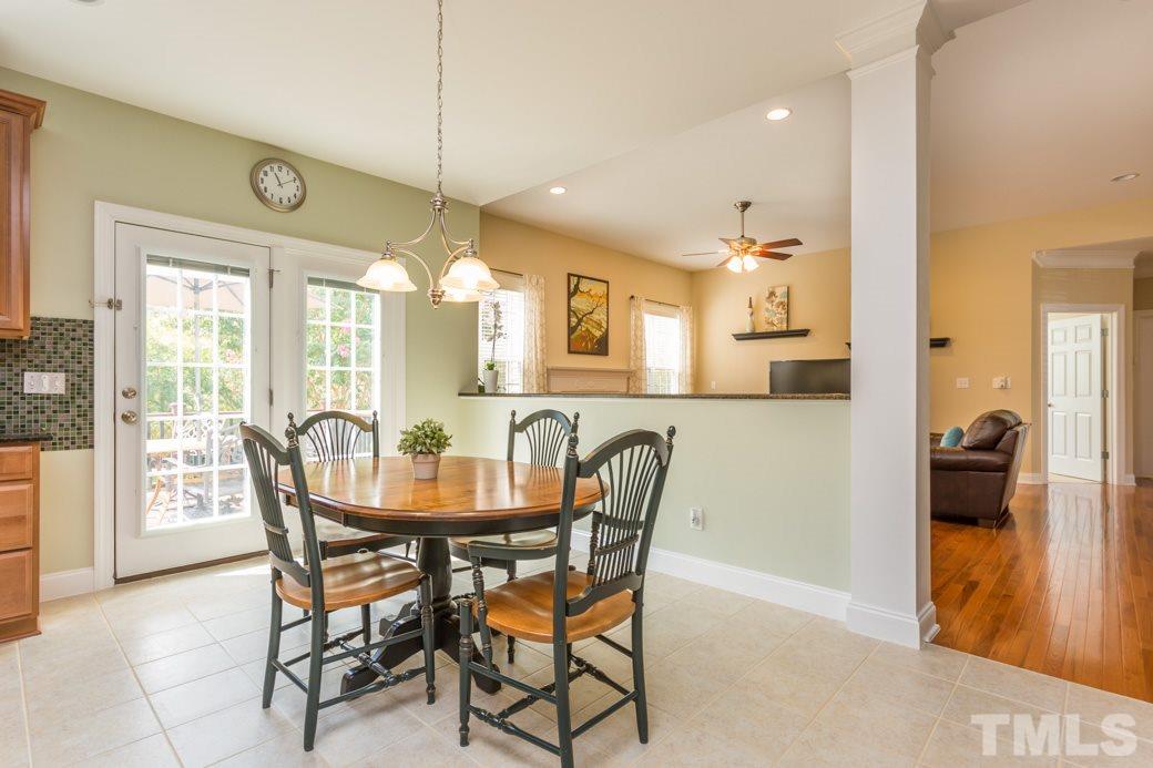 404 Powers Ferry Road Cary, NC 27519 - Photo 7 of 25 French doors from the breakfast room opens to the to Trek deck and stunning view of the professionally landscaped backyard.