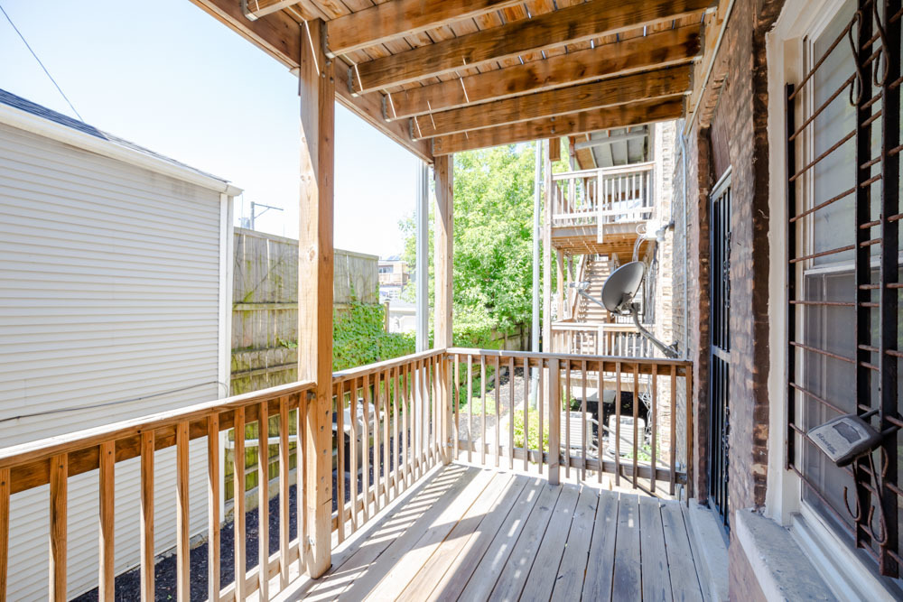 2641 West George Street, Unit 1 Chicago, IL 60618 - Photo 10 of 11 a view of a balcony with wooden floor