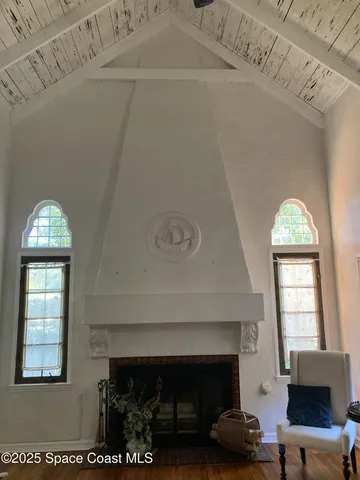 a kitchen with granite countertop a stove and a wooden cabinets