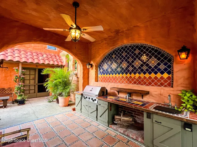 a view of kitchen with cabinets and refrigerator