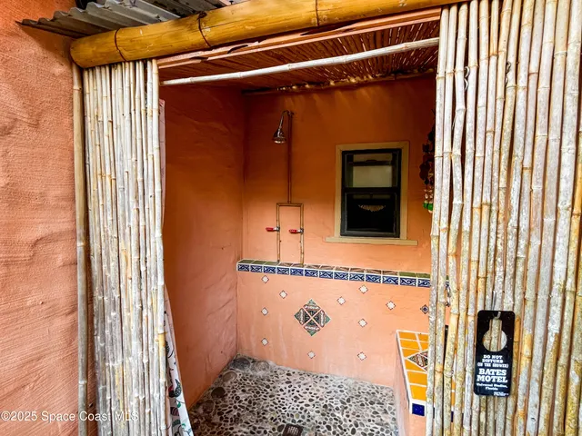 an aerial view of multiple houses with yard