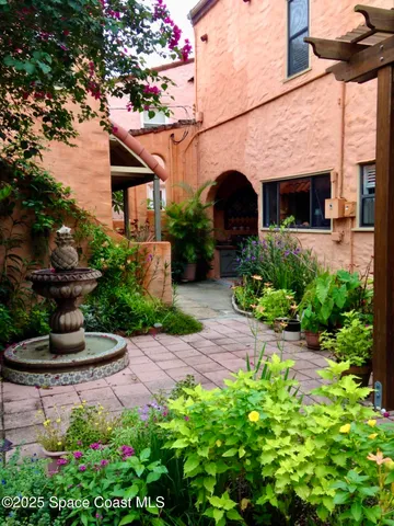 an aerial view of a house with a lake view
