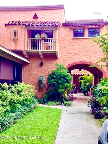 a view of a building with a yard