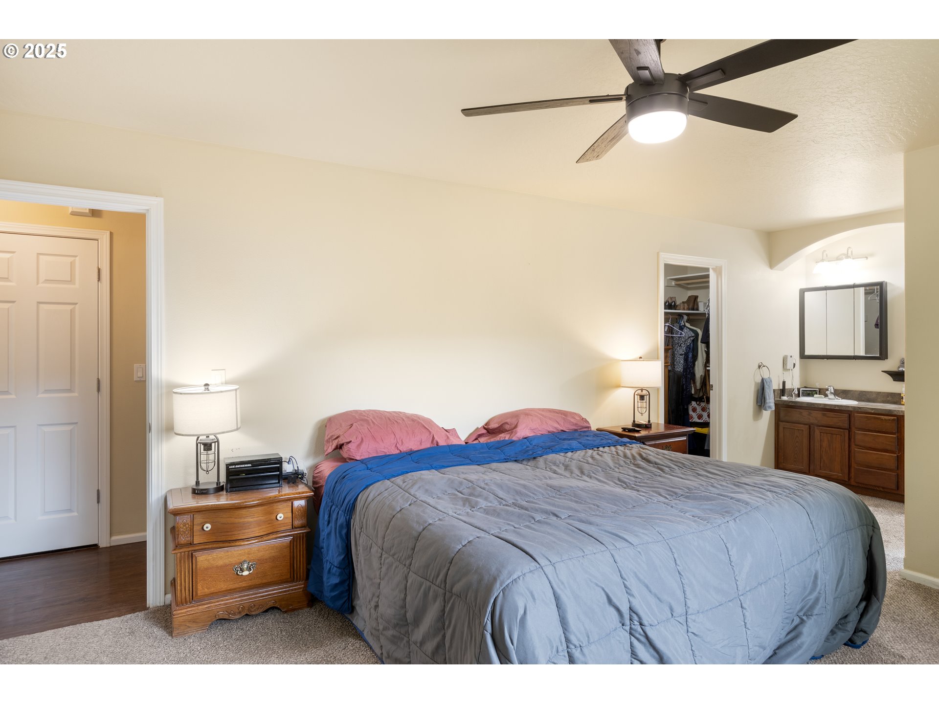 335 Gentry Loop Myrtle Creek, OR 97457 - Photo 16 of 41 a bedroom with a bed and a chandelier