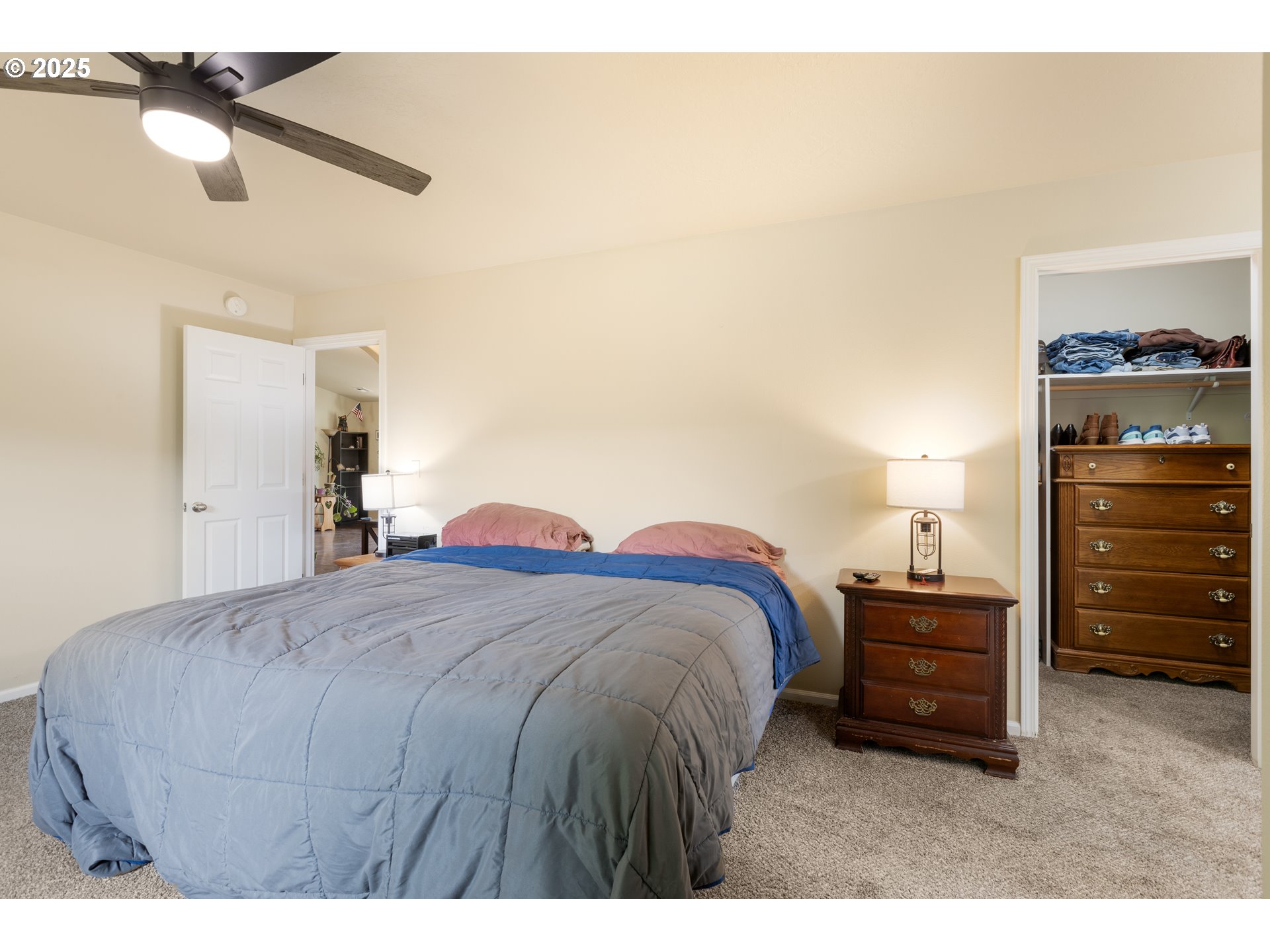 335 Gentry Loop Myrtle Creek, OR 97457 - Photo 17 of 41 a bedroom with a bed and a chandelier