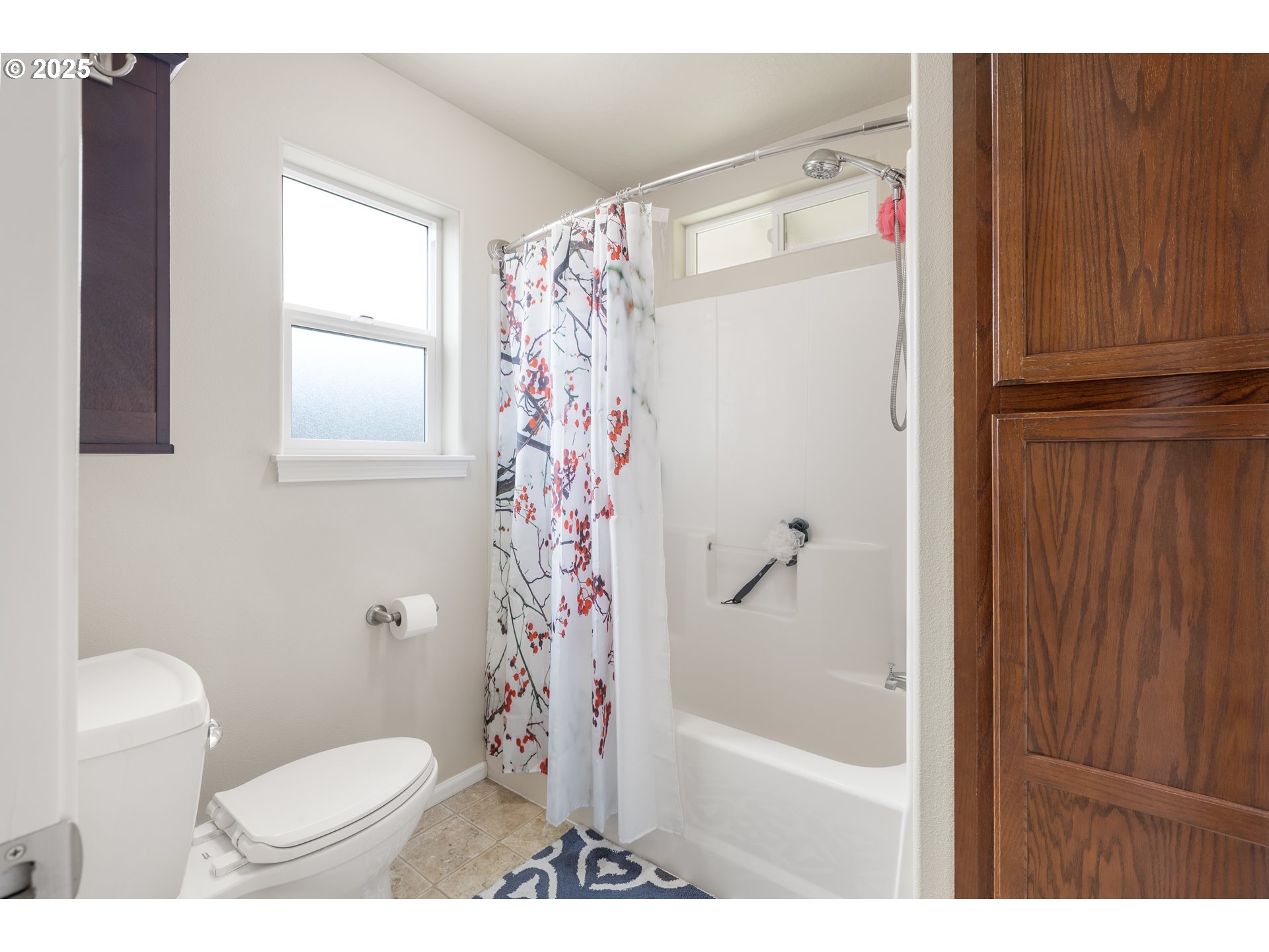 335 Gentry Loop Myrtle Creek, OR 97457 - Photo 19 of 41 a bathroom with a toilet and a shower curtain