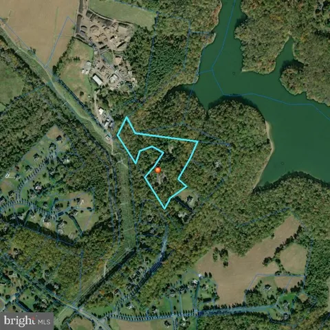 an aerial view of a residential houses with outdoor space