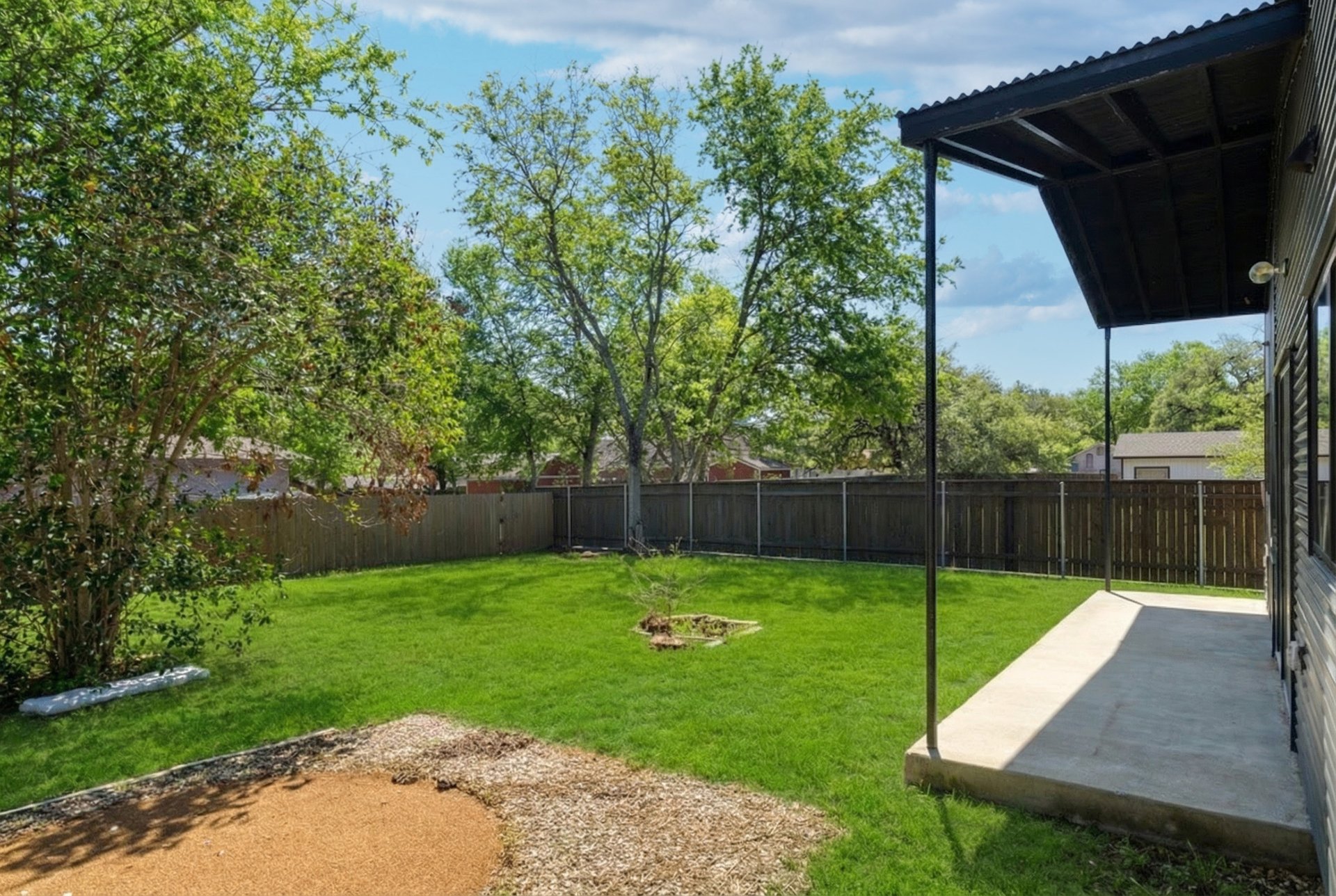 1310 Green Street Lockhart, TX 78644 - Photo 24 of 25 Fenced backyard with a patio area