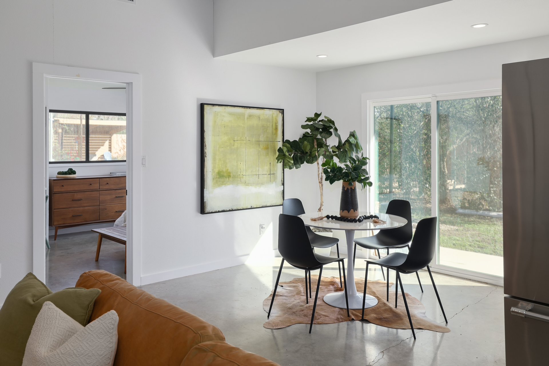 1310 Green Street Lockhart, TX 78644 - Photo 8 of 25 Dining room featuring finished concrete floors and plenty of natural light