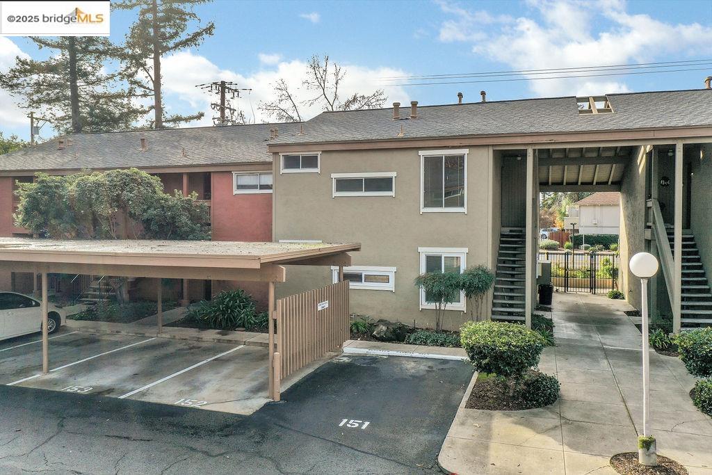 810 Oak Grove Road, Unit 102 Concord, CA 94518 - Photo 1 of 1 a view of a patio with table and chairs and potted plants