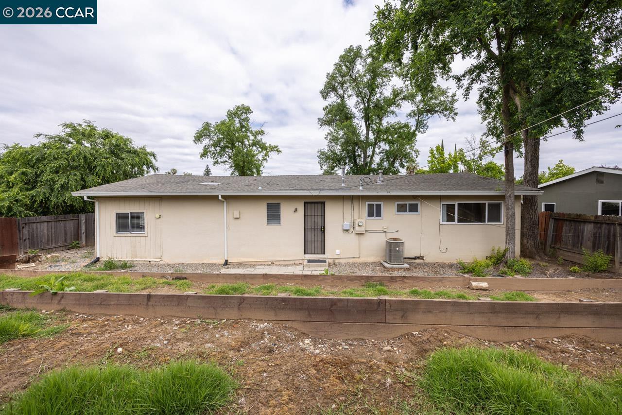 6118 Rutland Drive Carmichael, CA 95608 - Photo 19 of 19 a front view of a house with a yard
