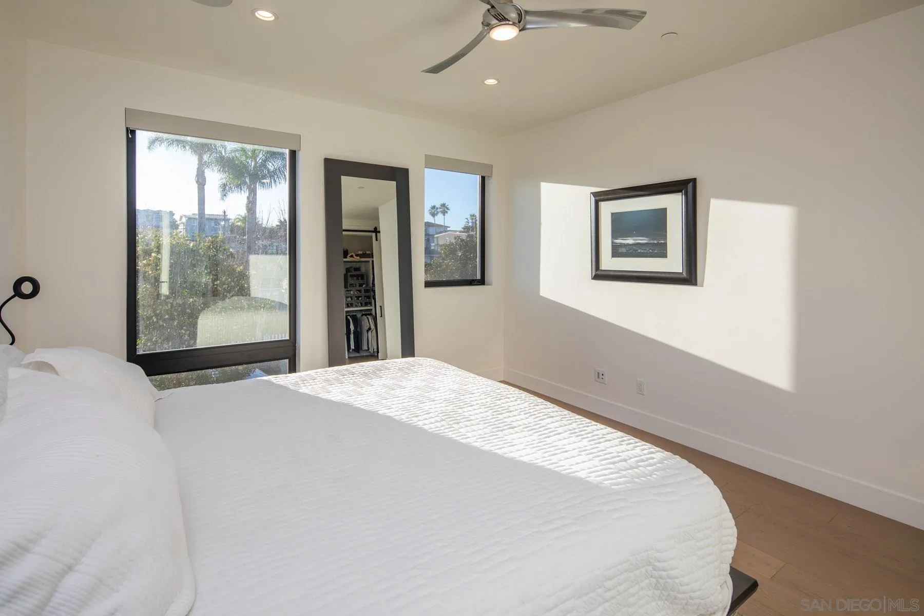 307 La Mesa Avenue Encinitas, CA 92024 - Photo 15 of 33 a bedroom with a large bed and a window