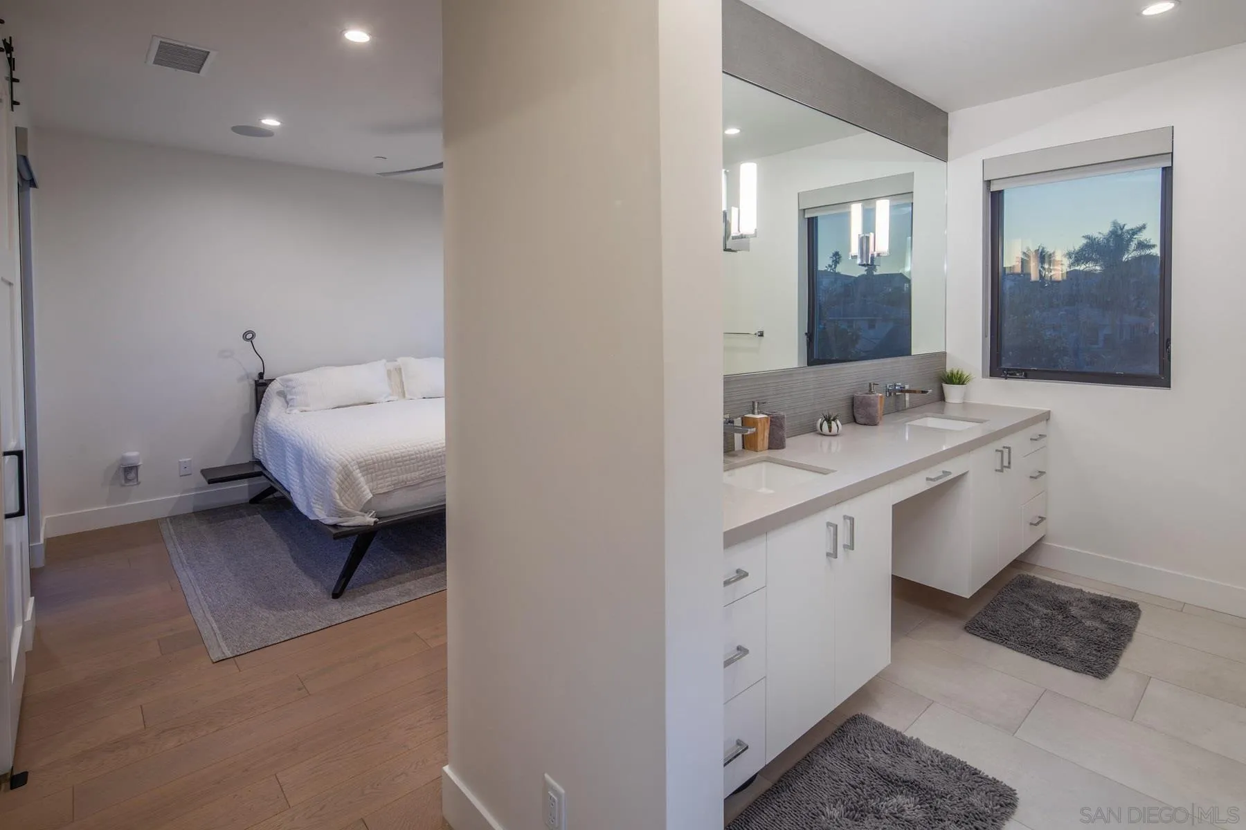 307 La Mesa Avenue Encinitas, CA 92024 - Photo 16 of 33 a en suite bathroom with a double vanity sink and a mirror