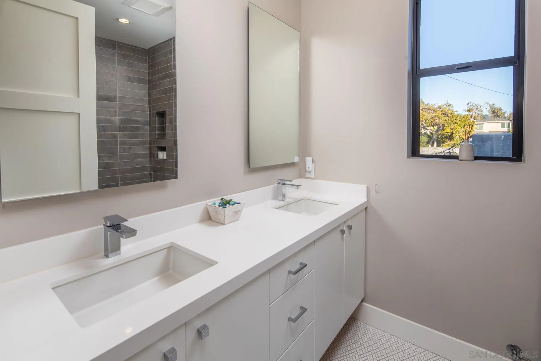 307 La Mesa Avenue Encinitas, CA 92024 - Photo 20 of 33 a bathroom with a sink and a mirror