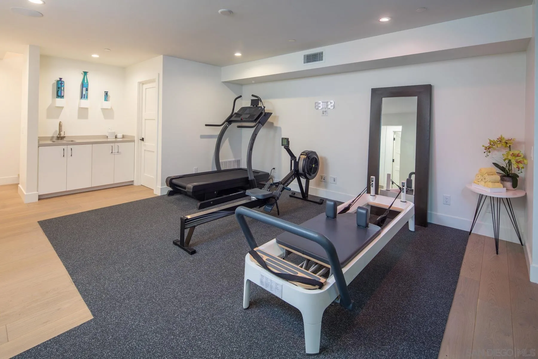 307 La Mesa Avenue Encinitas, CA 92024 - Photo 24 of 33 a room with furniture gym equipment and a view of living room