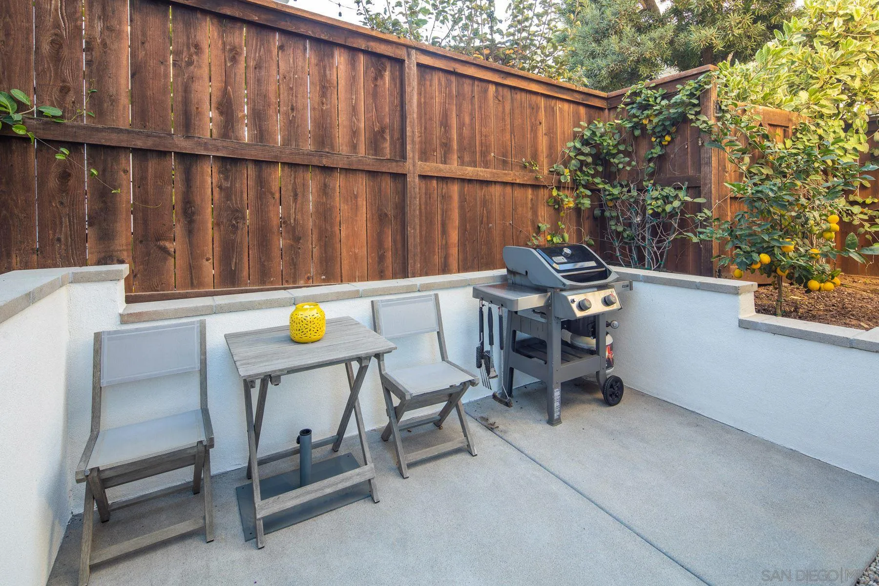 307 La Mesa Avenue Encinitas, CA 92024 - Photo 29 of 33 a view of a chairs and table in the back yard of the house