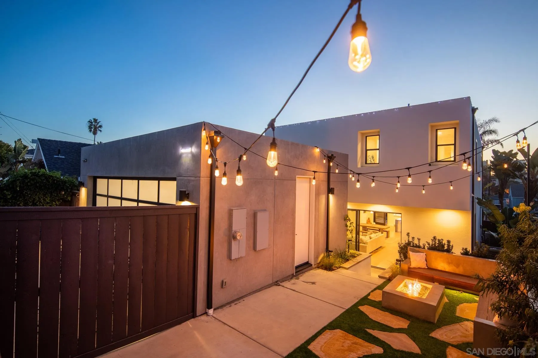 307 La Mesa Avenue Encinitas, CA 92024 - Photo 32 of 33 a bedroom with a bed and a chandelier