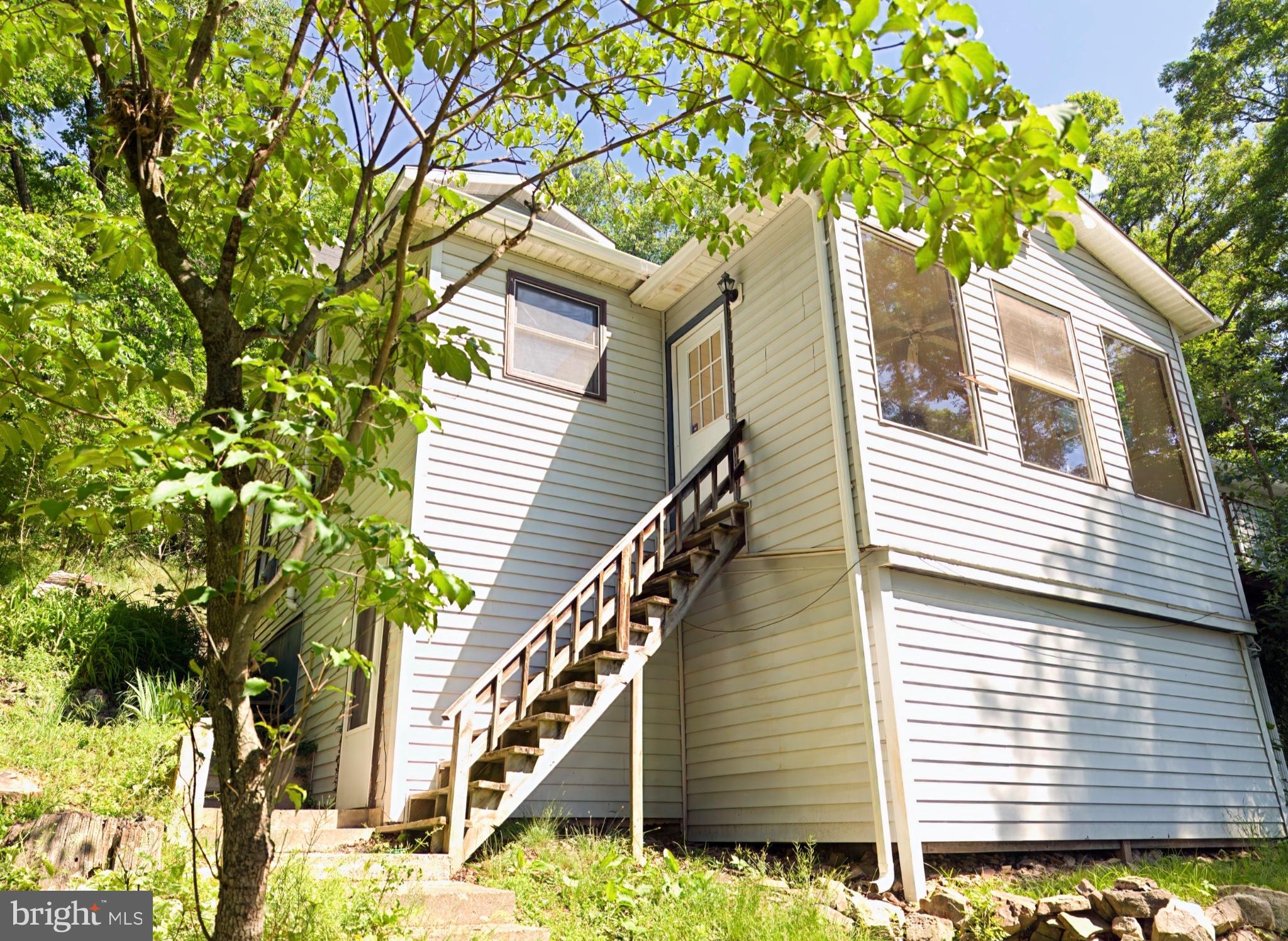 2932 Kerns School Road Springfield, WV 26763 - Photo 29 of 35 Charming hillside retreat with greenery.