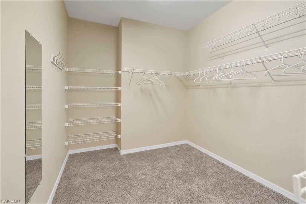 20516 Larino Loop Estero, FL 33928 - Photo 20 of 45 Spacious closet featuring light carpet