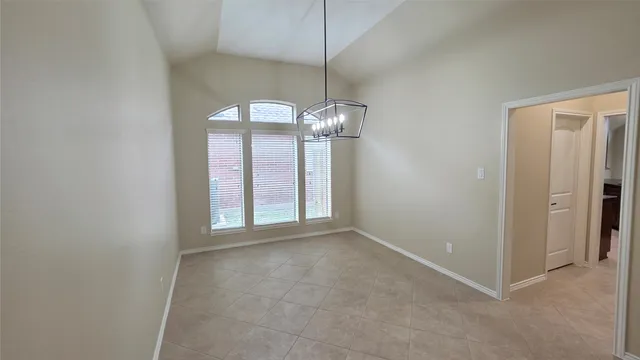 a kitchen with stainless steel appliances granite countertop a stove top oven a sink dishwasher and cabinets with wooden floor